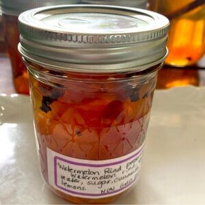 One half pint jar of Non GMO watermelon rind preserves from Yellow Flower Farm.